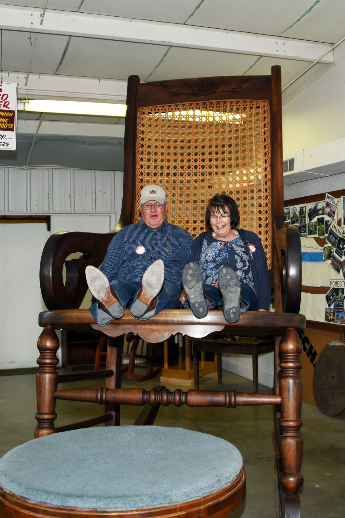 018 Curt and Mary Folkerts on Iowa's largest solid walnut rocker.JPG